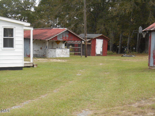 130 Holland Road Angier, NC 27501 - Photo 4 of 22 a front view of a house with swimming pool