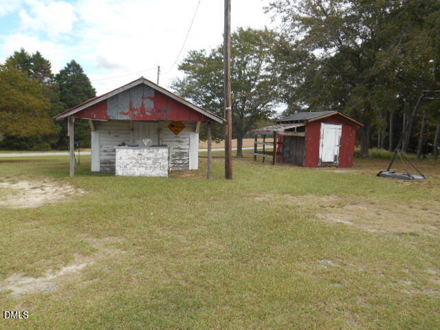 130 Holland Road Angier, NC 27501 - Photo 5 of 22 a view of a house with a yard