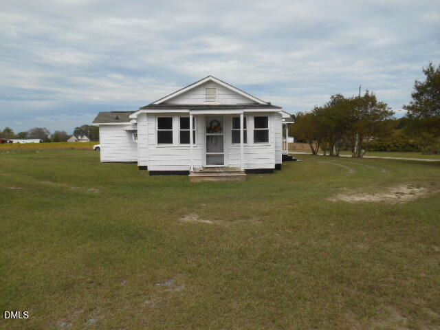 130 Holland Road Angier, NC 27501 - Photo 6 of 22 a front view of a house with a yard