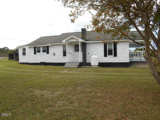130 Holland Road Angier, NC 27501 - Photo 8 of 22 a front view of a house with a garden