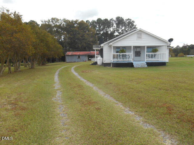 130 Holland Road Angier, NC 27501 - Photo 9 of 22 a front view of a house with swimming pool