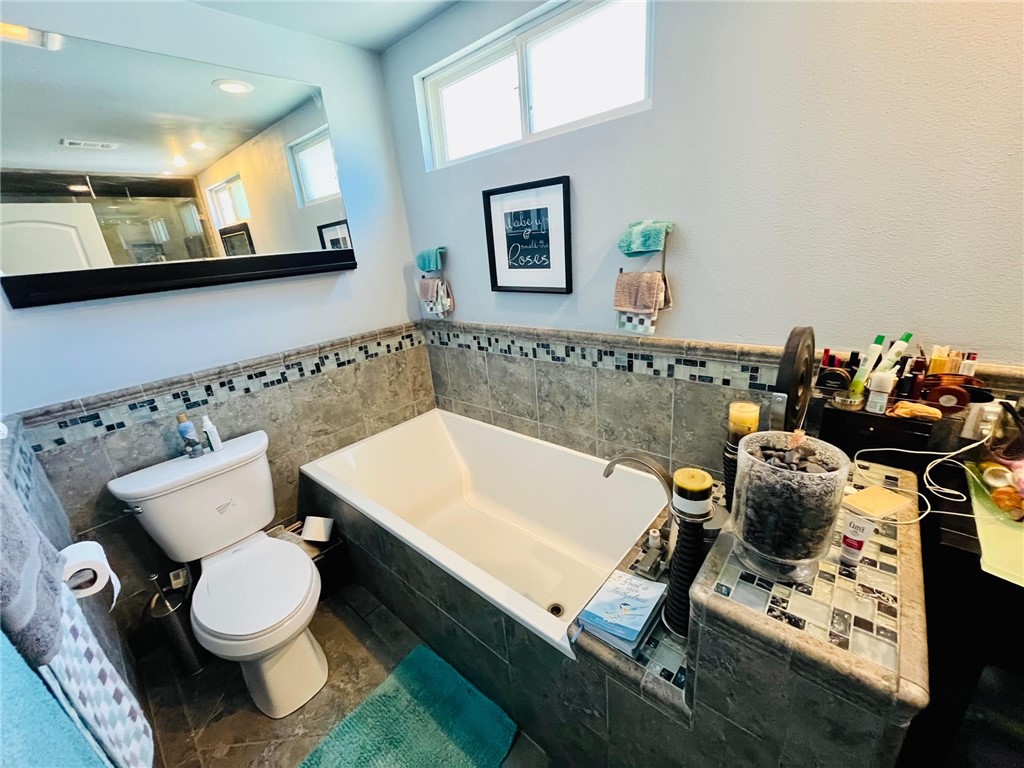 21945 Centurion Way Saugus, CA 91350 - Photo 12 of 25 a bathroom with a sink toilet and mirror