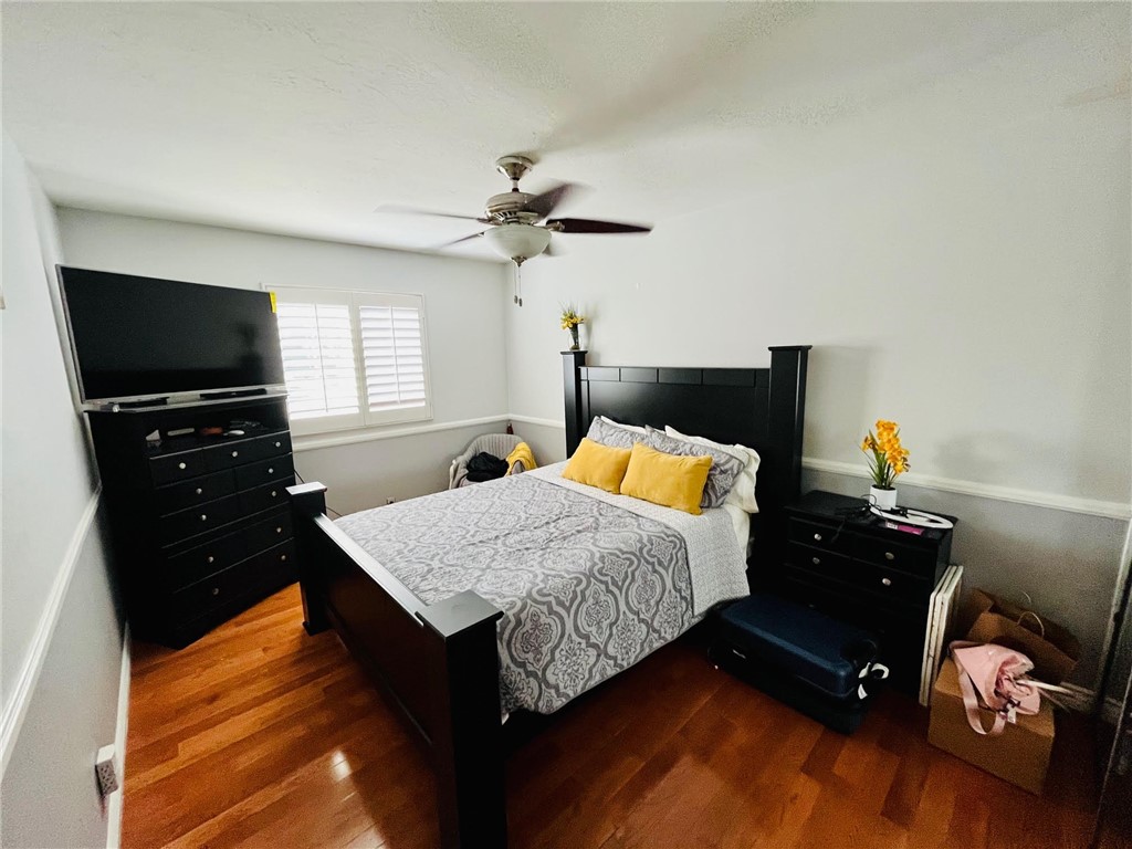 21945 Centurion Way Saugus, CA 91350 - Photo 15 of 25 a bedroom with a bed and a flat screen tv