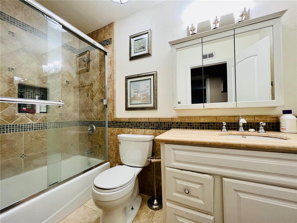 21945 Centurion Way Saugus, CA 91350 - Photo 17 of 25 a bathroom with a sink a toilet and a bathtub