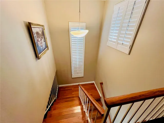 a view of a hallway with windows