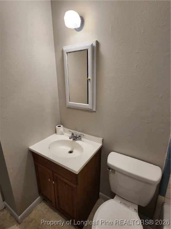 4617 Belford Road Fayetteville, NC 28314 - Photo 11 of 21 a bathroom with a toilet sink and mirror