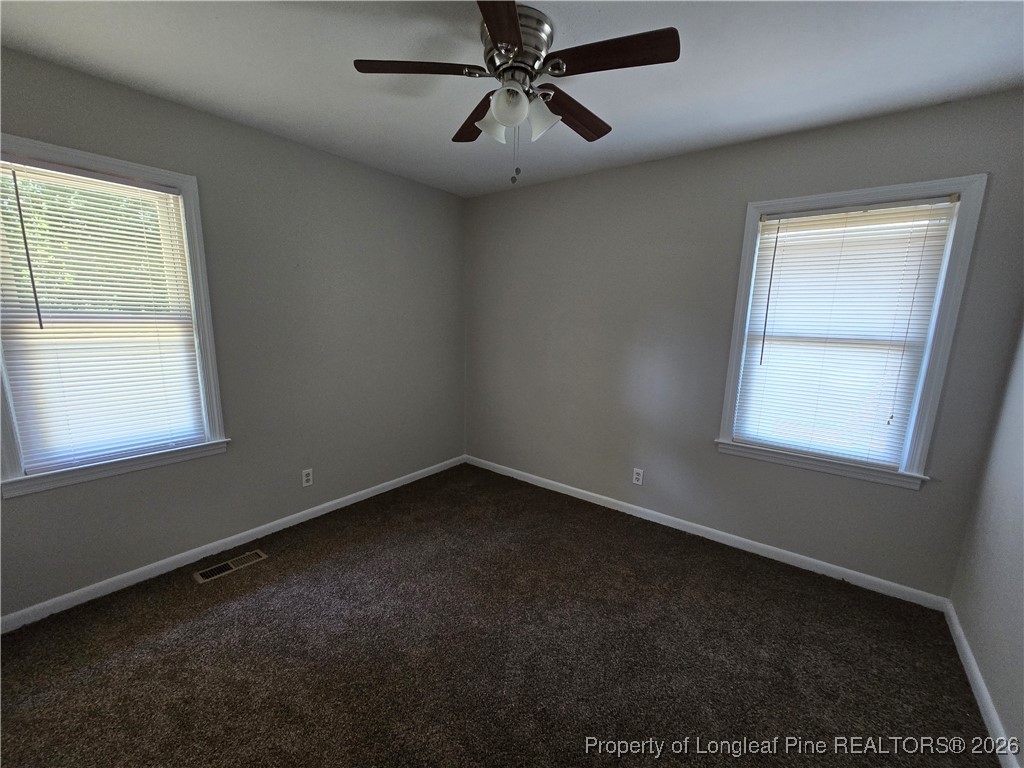 4617 Belford Road Fayetteville, NC 28314 - Photo 14 of 21 an empty room with a window and a fan