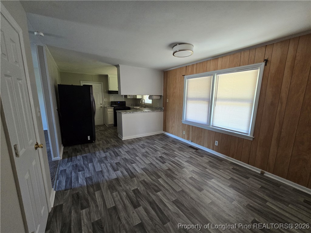 4617 Belford Road Fayetteville, NC 28314 - Photo 4 of 21 a view of a room with wooden floor and a window