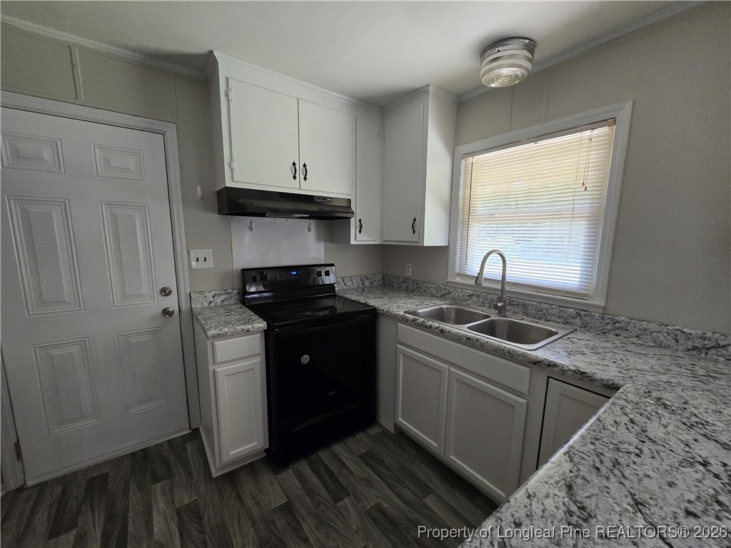 4617 Belford Road Fayetteville, NC 28314 - Photo 5 of 21 a kitchen with a sink stove and refrigerator