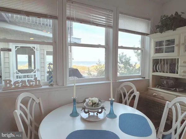 a dining room with furniture wooden floor and a table