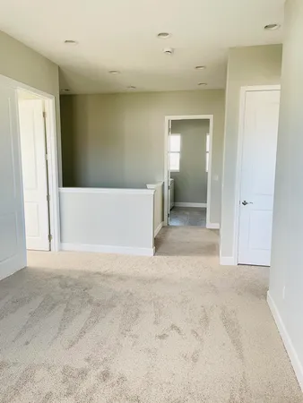 a view of a big room with closet and windows