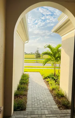 a view of a swimming pool with an outdoor space and seating area