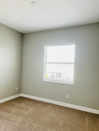 a white bath tub sitting next to a white toilet