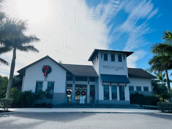 a couple of palm trees sitting in front of a house