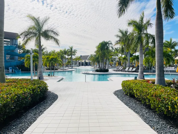 a view of a garden with a bench in patio