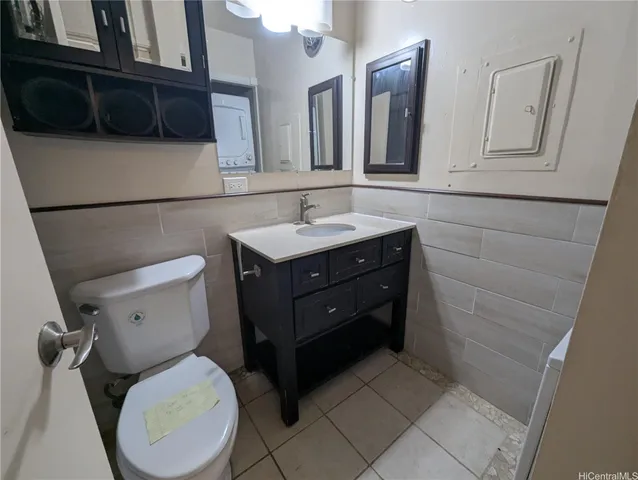 a bathroom with a toilet a sink and a mirror