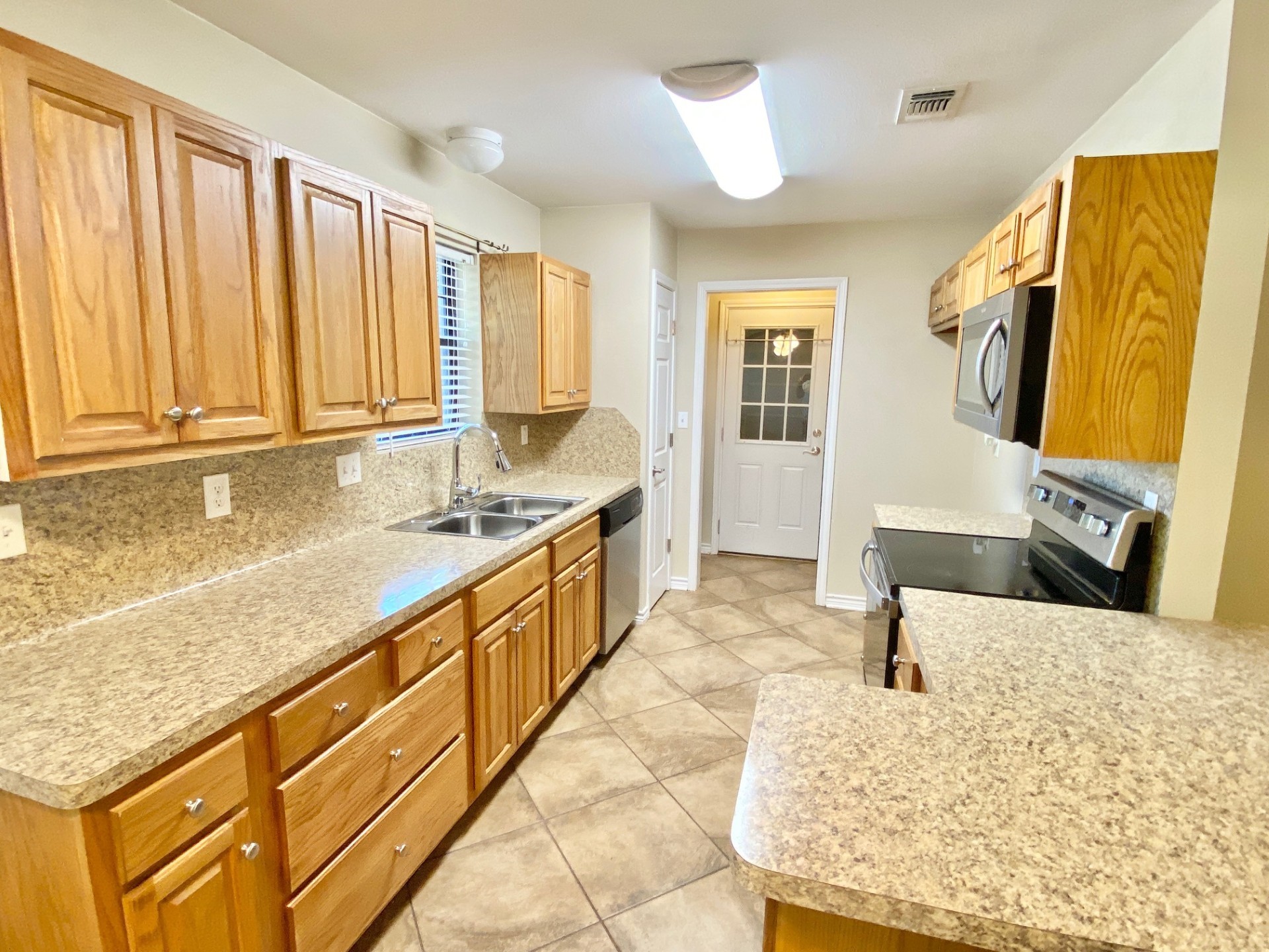 2745 Bethlehem Road Lufkin, TX 75904 - Photo 7 of 14 a large bathroom with kitchen island granite countertop a sink and a mirror