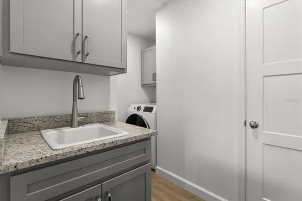 a bathroom with a toilet a sink and a mirror