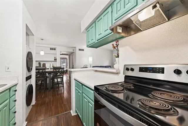 a kitchen with stainless steel appliances granite countertop a stove and a sink