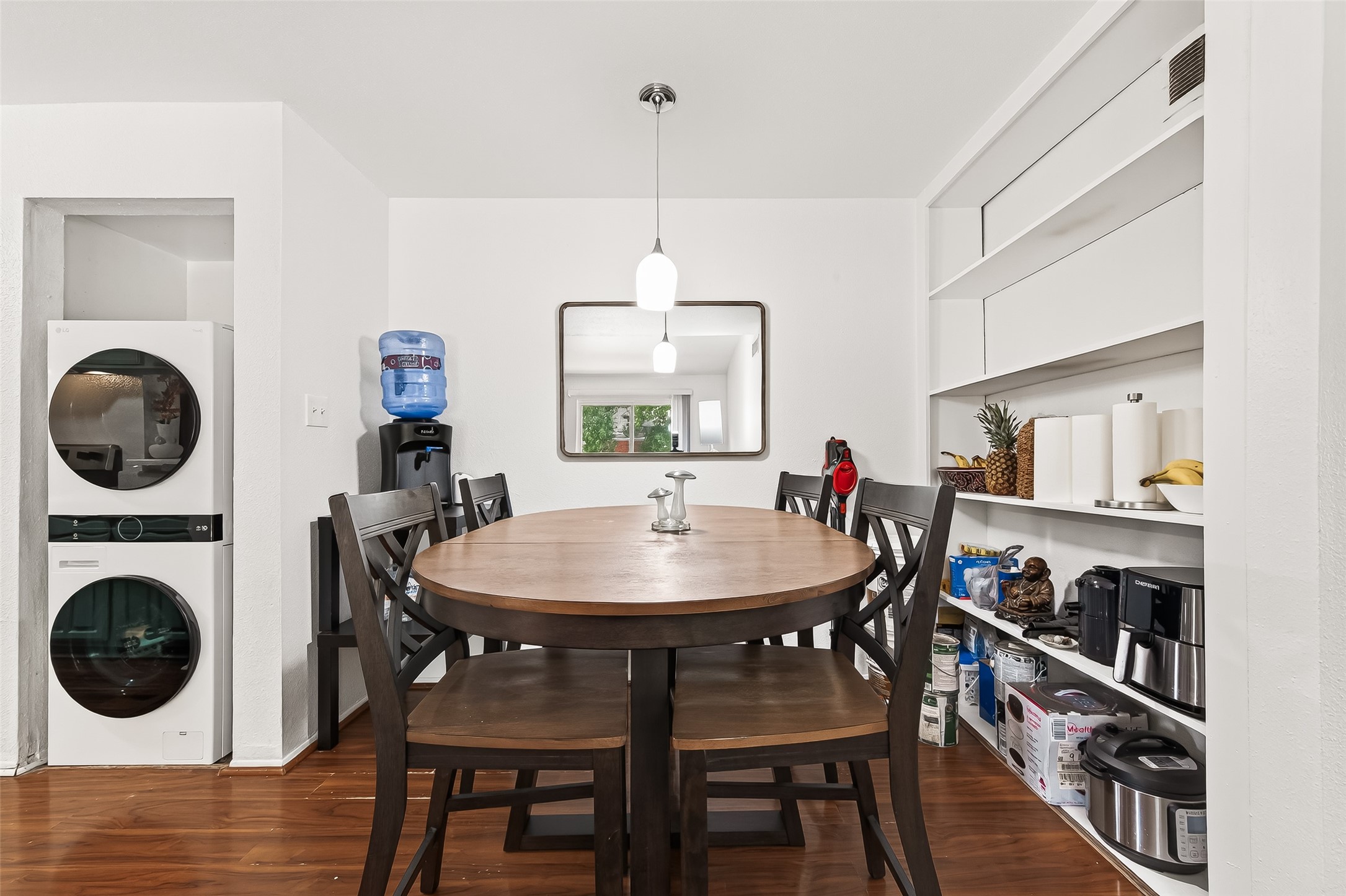 6001 Reims Road, Unit 908 Houston, TX 77036 - Photo 15 of 31 a view of a dining room with furniture and wooden floor