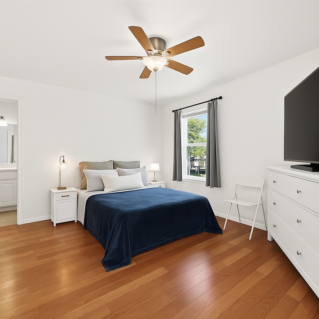 6001 Reims Road, Unit 908 Houston, TX 77036 - Photo 17 of 31 a bedroom with a large bed and a flat screen tv