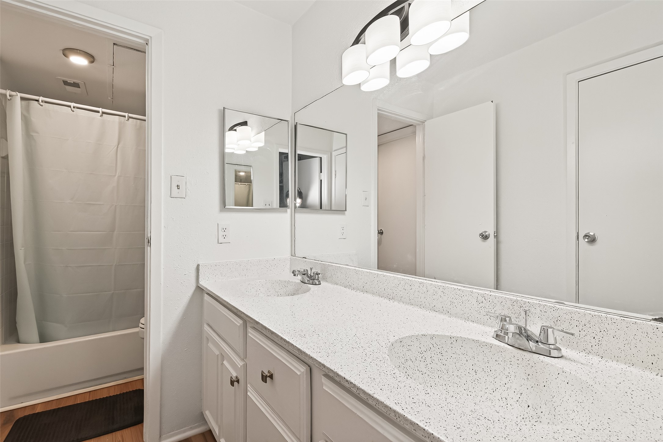 6001 Reims Road, Unit 908 Houston, TX 77036 - Photo 19 of 31 a bathroom with a sink a mirror and a shower