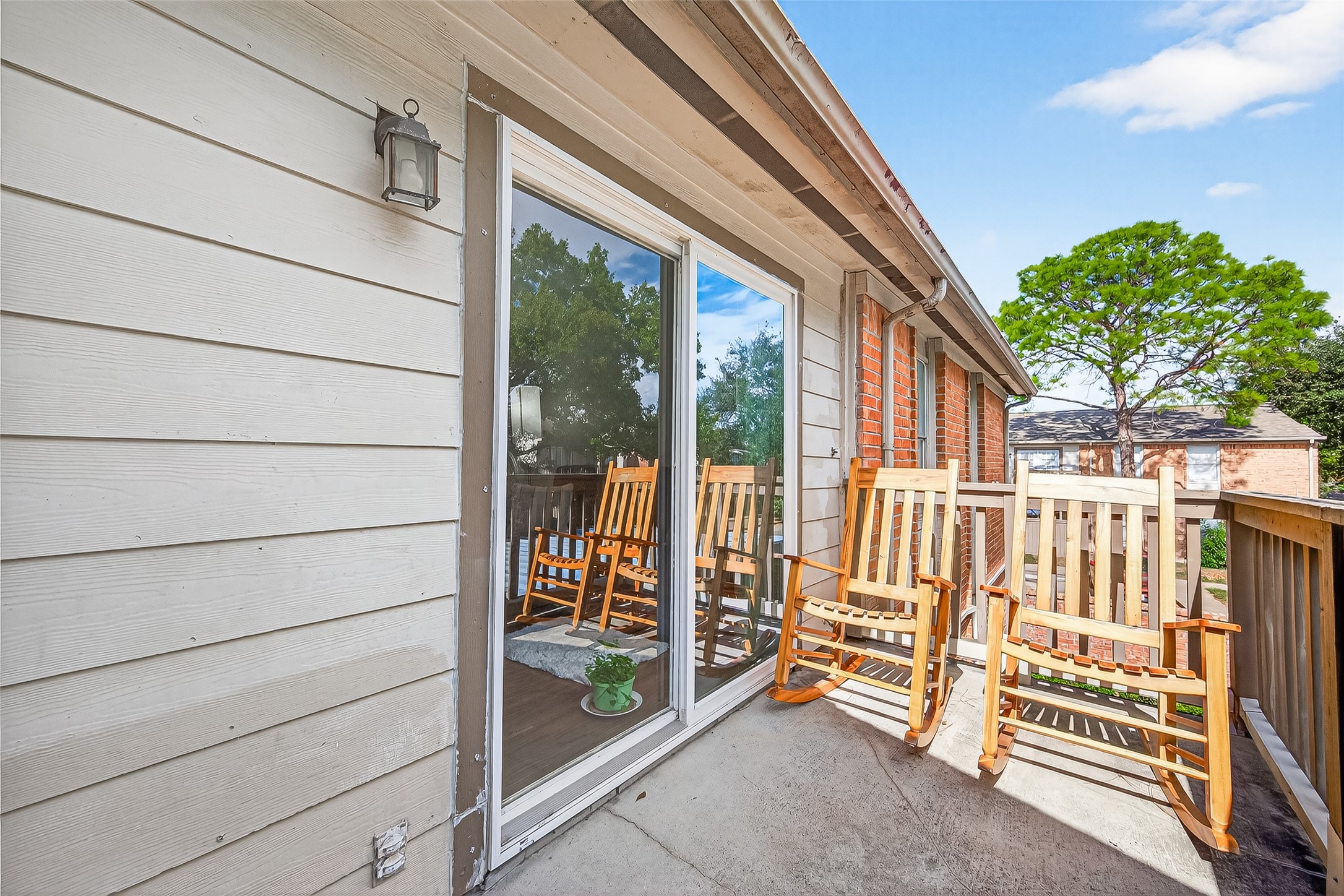 6001 Reims Road, Unit 908 Houston, TX 77036 - Photo 22 of 31 a view of a porch with a bench