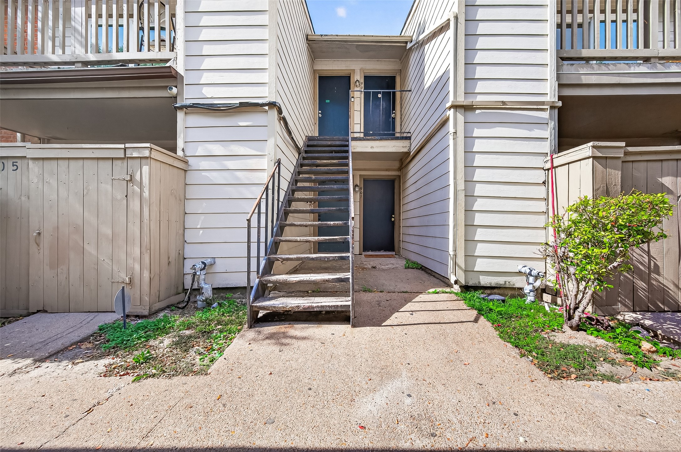 6001 Reims Road, Unit 908 Houston, TX 77036 - Photo 28 of 31 a view of a house with a yard and a garage