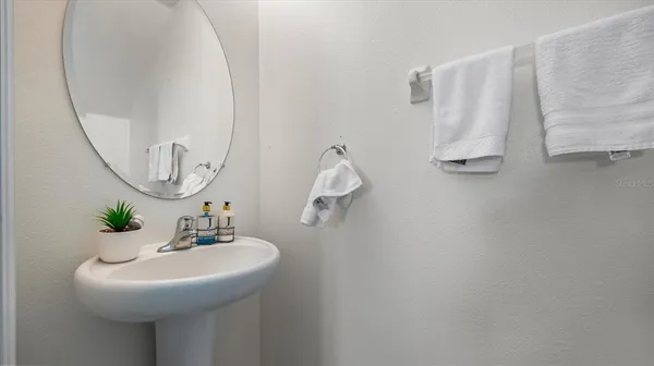 a bathroom with a sink and mirror