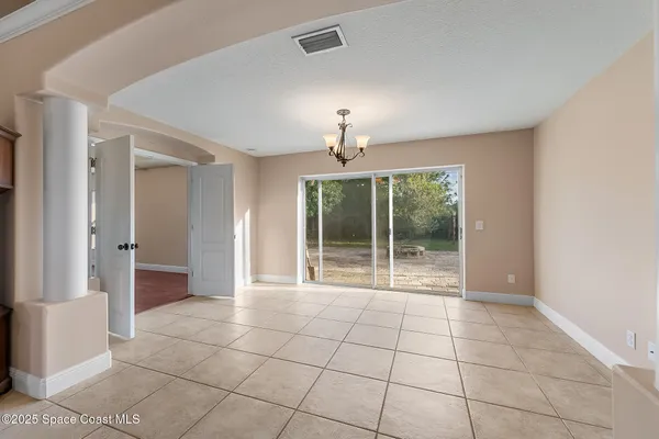 a view of a kitchen with furniture and a window