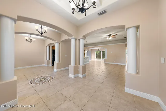 a view of a kitchen with furniture and a window