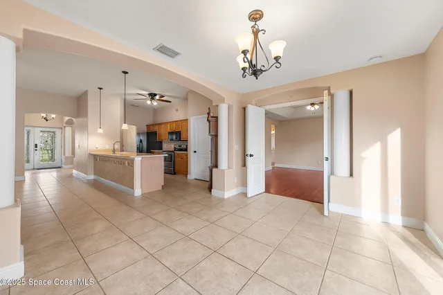 a kitchen with stainless steel appliances granite countertop a sink and a microwave