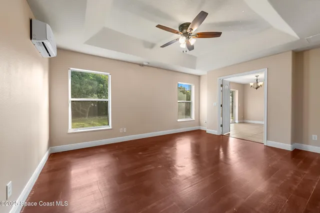 a spacious bathroom with a double vanity sink mirror and bathtub