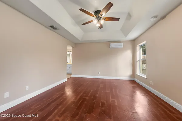 an aerial view of residential houses with outdoor space and swimming pool