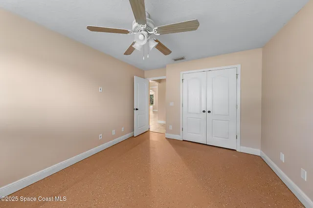 an aerial view of residential houses with outdoor space and swimming pool