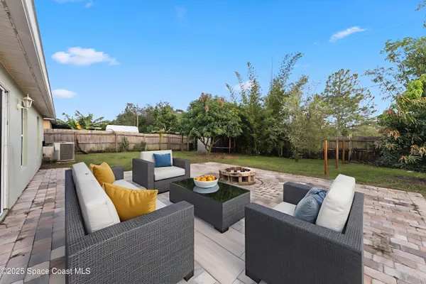 a bedroom with a large bed and a flat screen tv