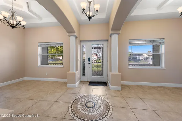 a view of an empty room with glass door