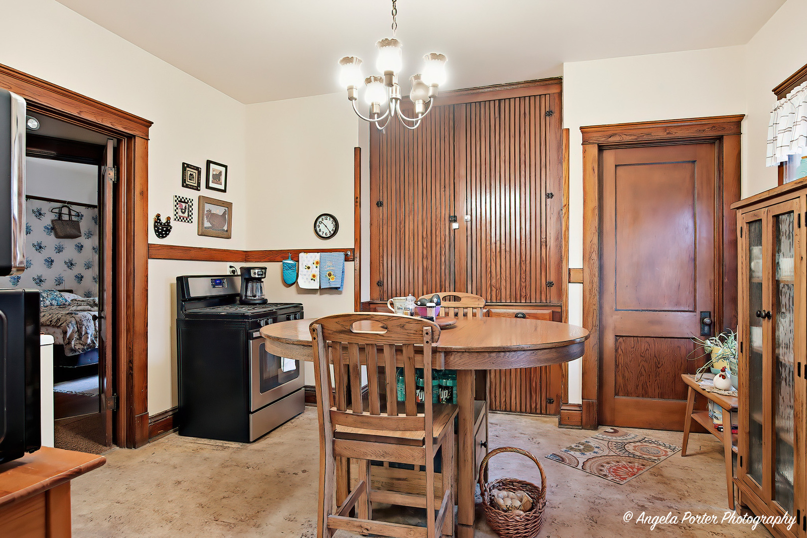 9712 St Albans Street Hebron, IL 60034 - Photo 11 of 28 a view of a dining room with furniture and chandelier