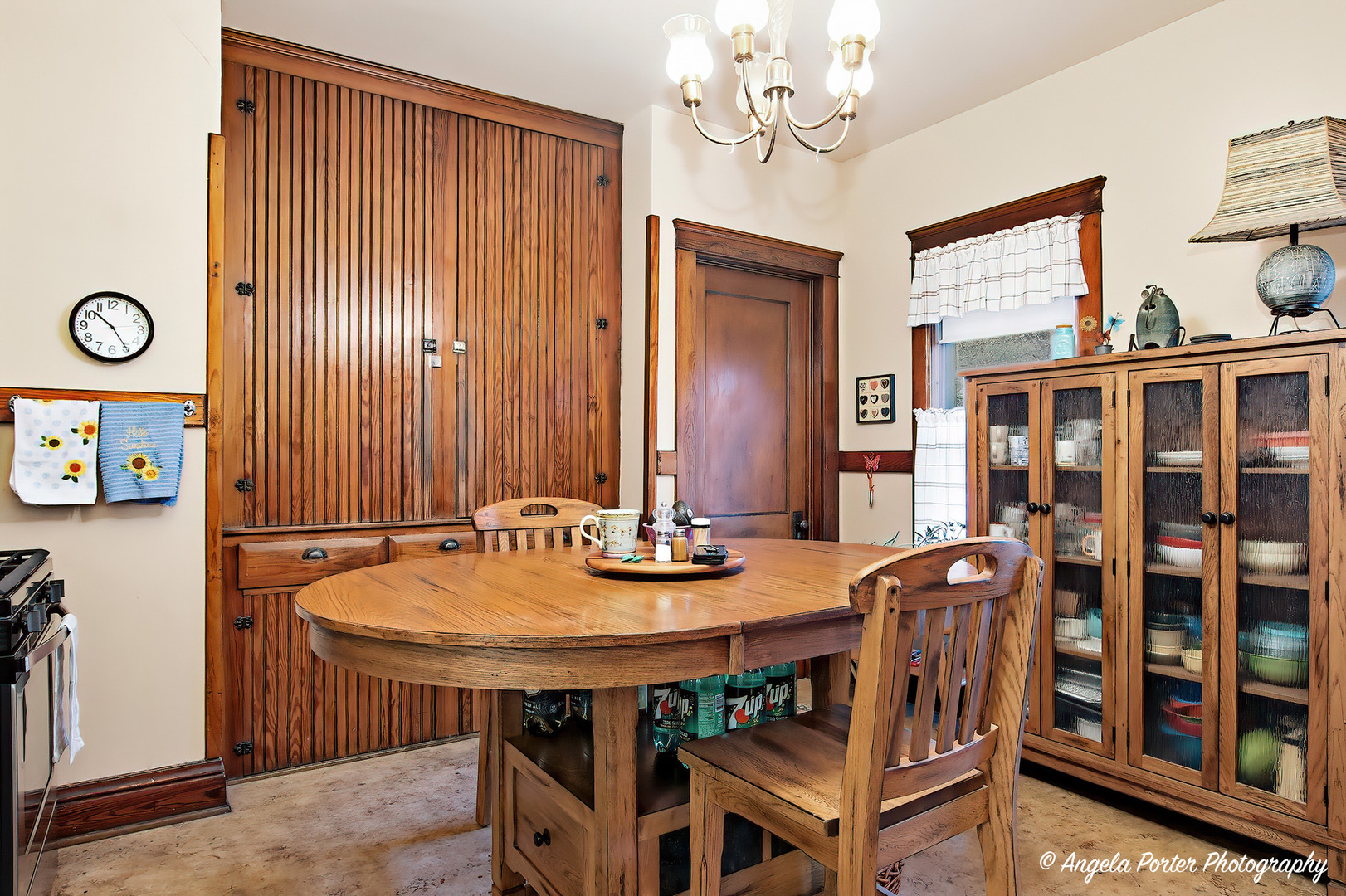 9712 St Albans Street Hebron, IL 60034 - Photo 13 of 28 a view of a dining room with furniture and chandelier