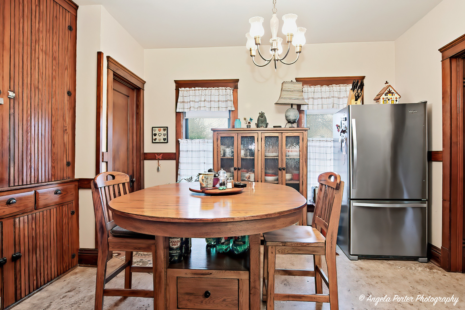 9712 St Albans Street Hebron, IL 60034 - Photo 14 of 28 a dining room with furniture a chandelier and wooden floor