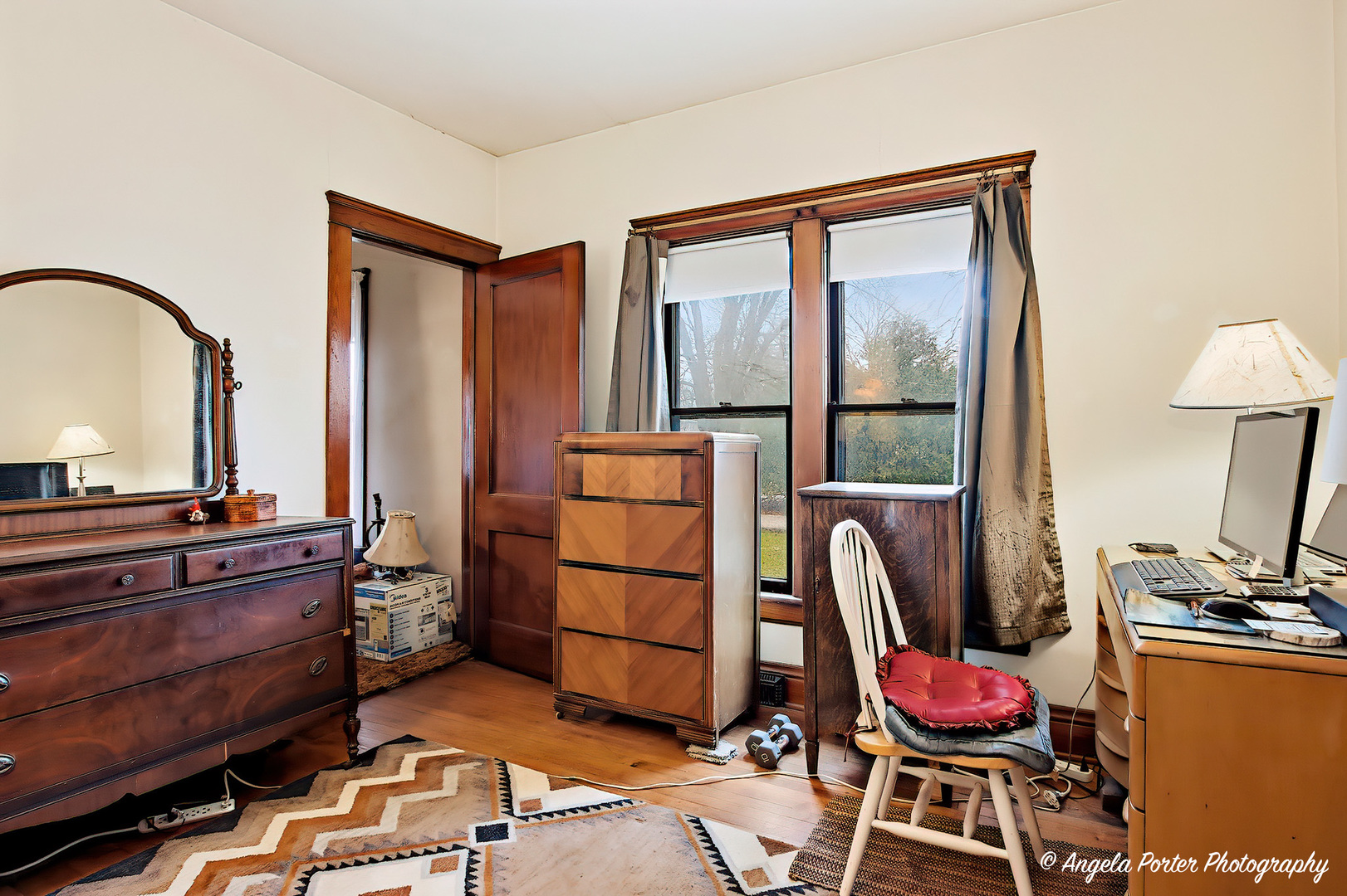 9712 St Albans Street Hebron, IL 60034 - Photo 7 of 28 a living room with furniture a flat screen tv and a window