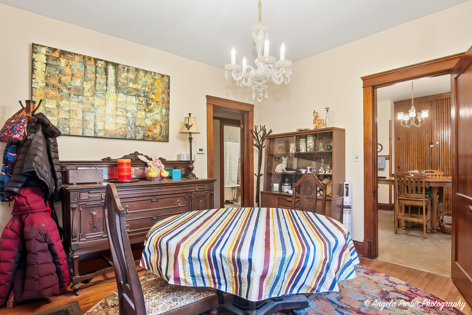 9712 St Albans Street Hebron, IL 60034 - Photo 9 of 28 a bedroom with a bed and a chandelier