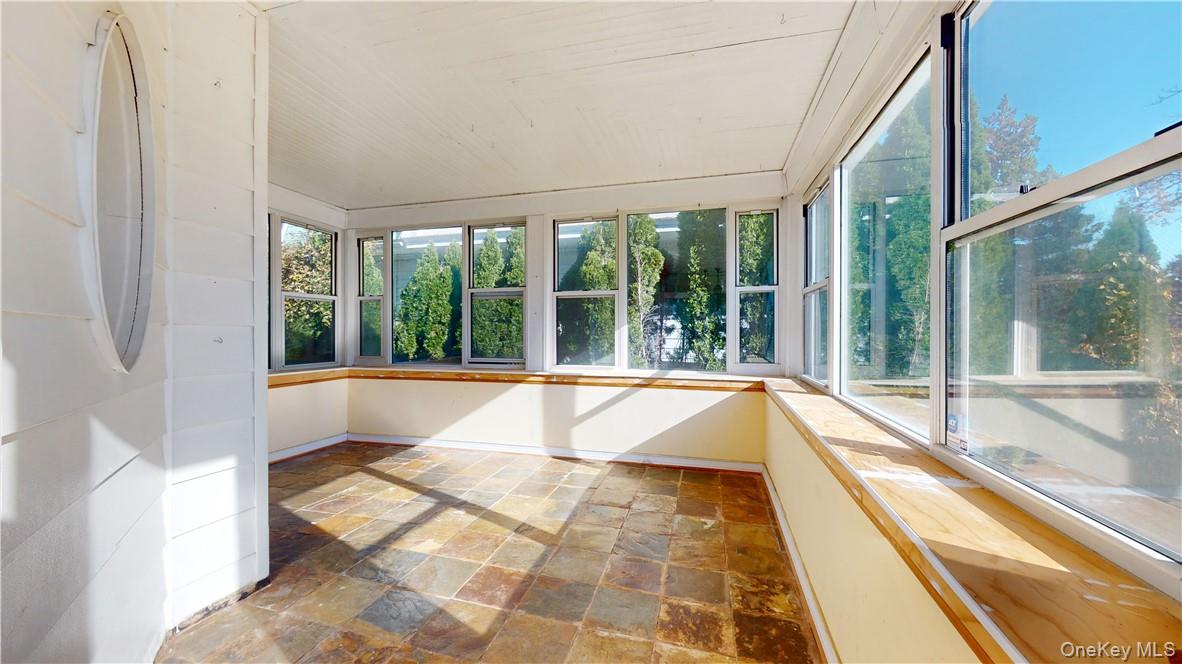 14 Hamilton Avenue New Rochelle, NY 10801 - Photo 7 of 33 Indoor sunroom with oversized windows and beautiful natural sun light, with plenty of room for seating or plants