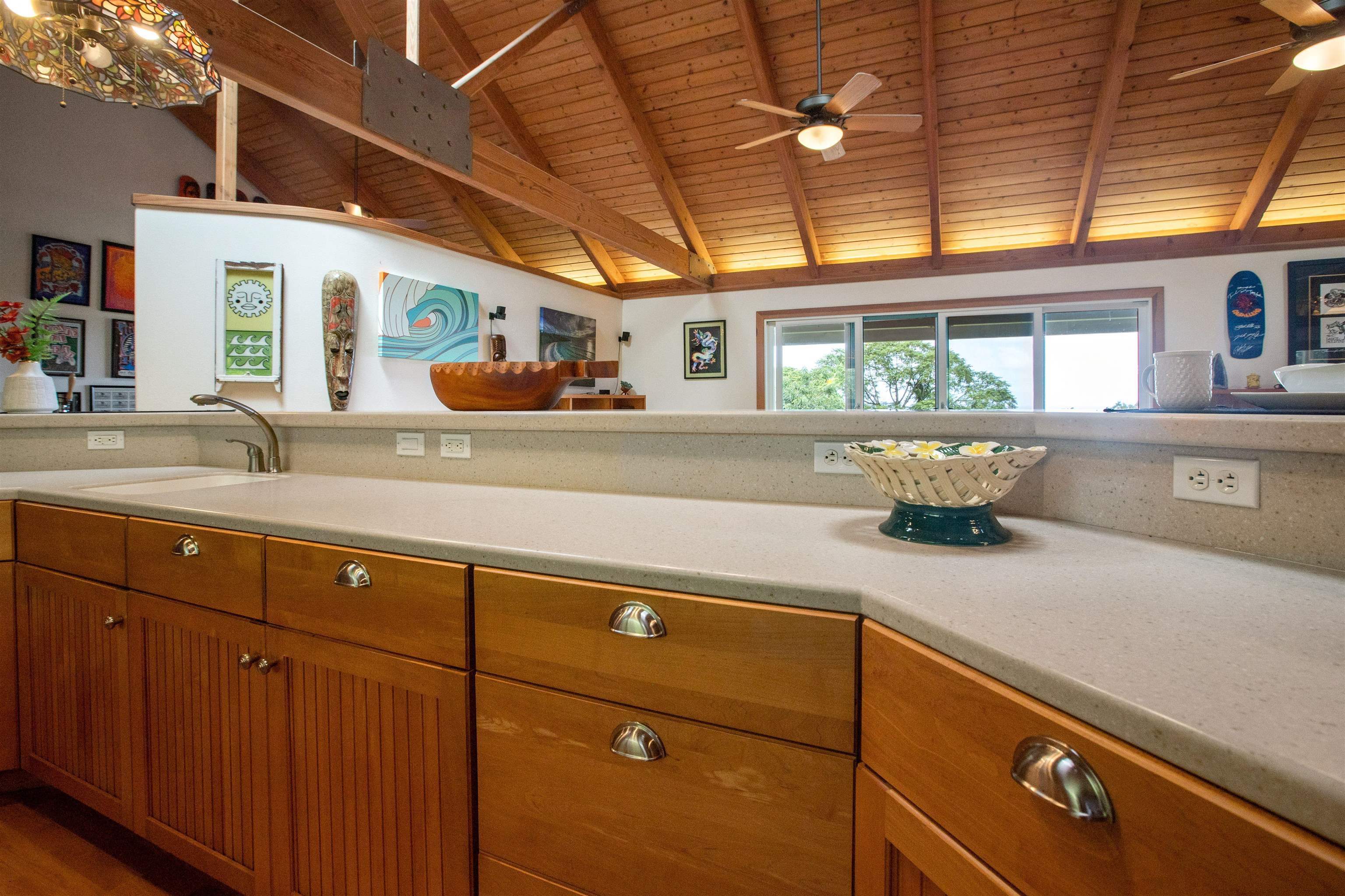 285 Kalo Road Hana, HI 96713 - Photo 11 of 36 a kitchen with stainless steel appliances granite countertop a sink a stove cabinets and wooden floor