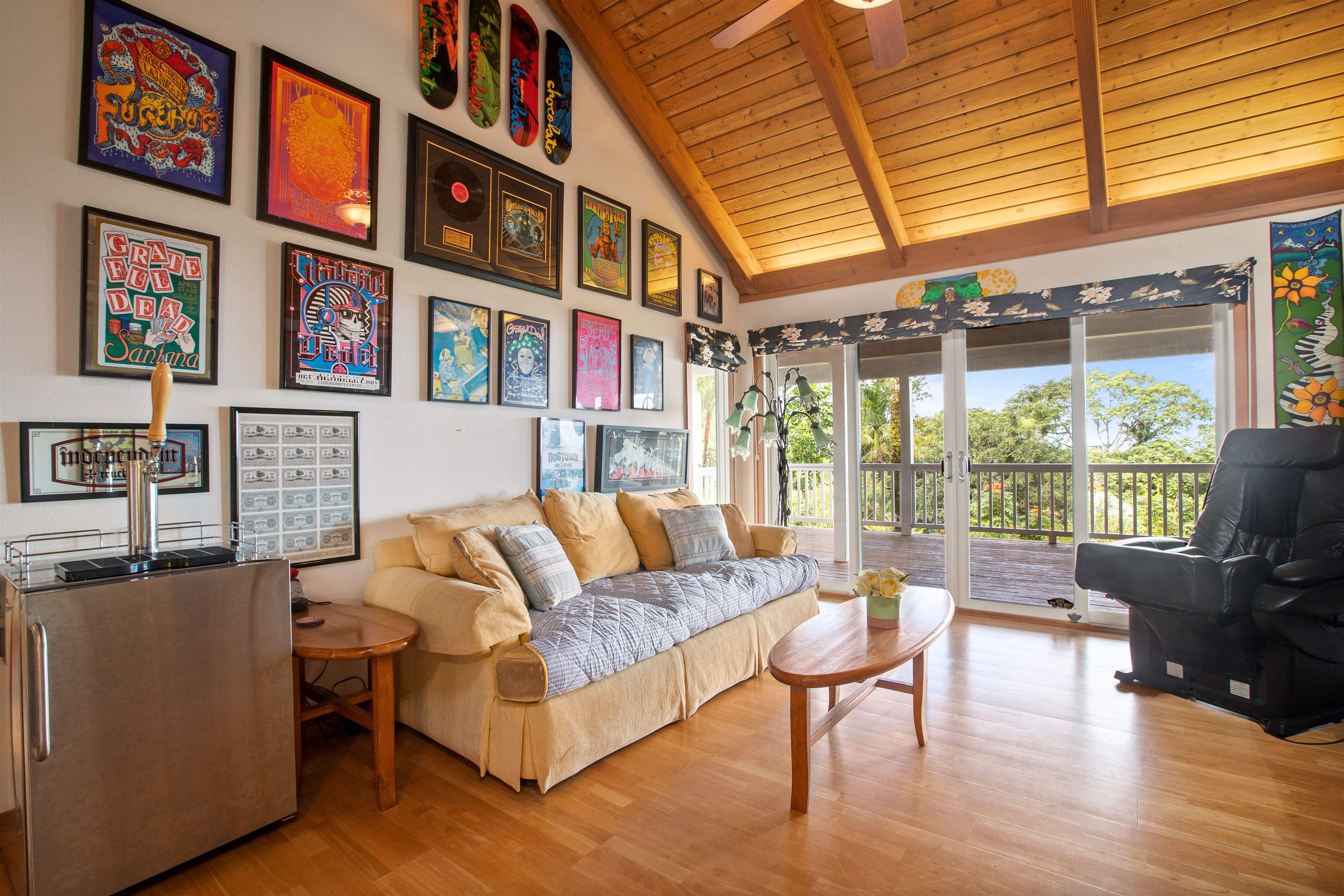 285 Kalo Road Hana, HI 96713 - Photo 12 of 36 a living room with fireplace furniture and a large window