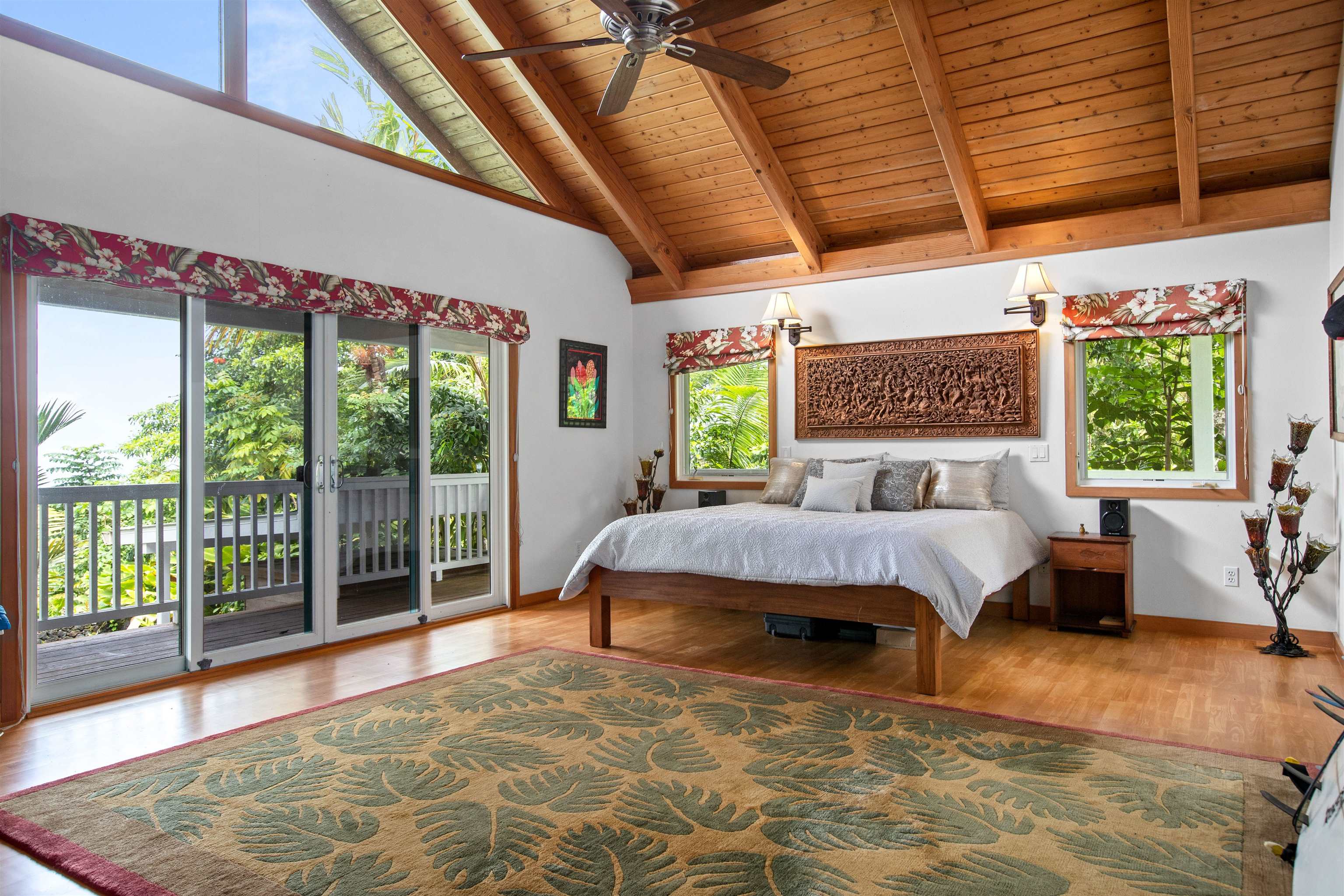 285 Kalo Road Hana, HI 96713 - Photo 16 of 36 a bed sitting in a bedroom next to a window