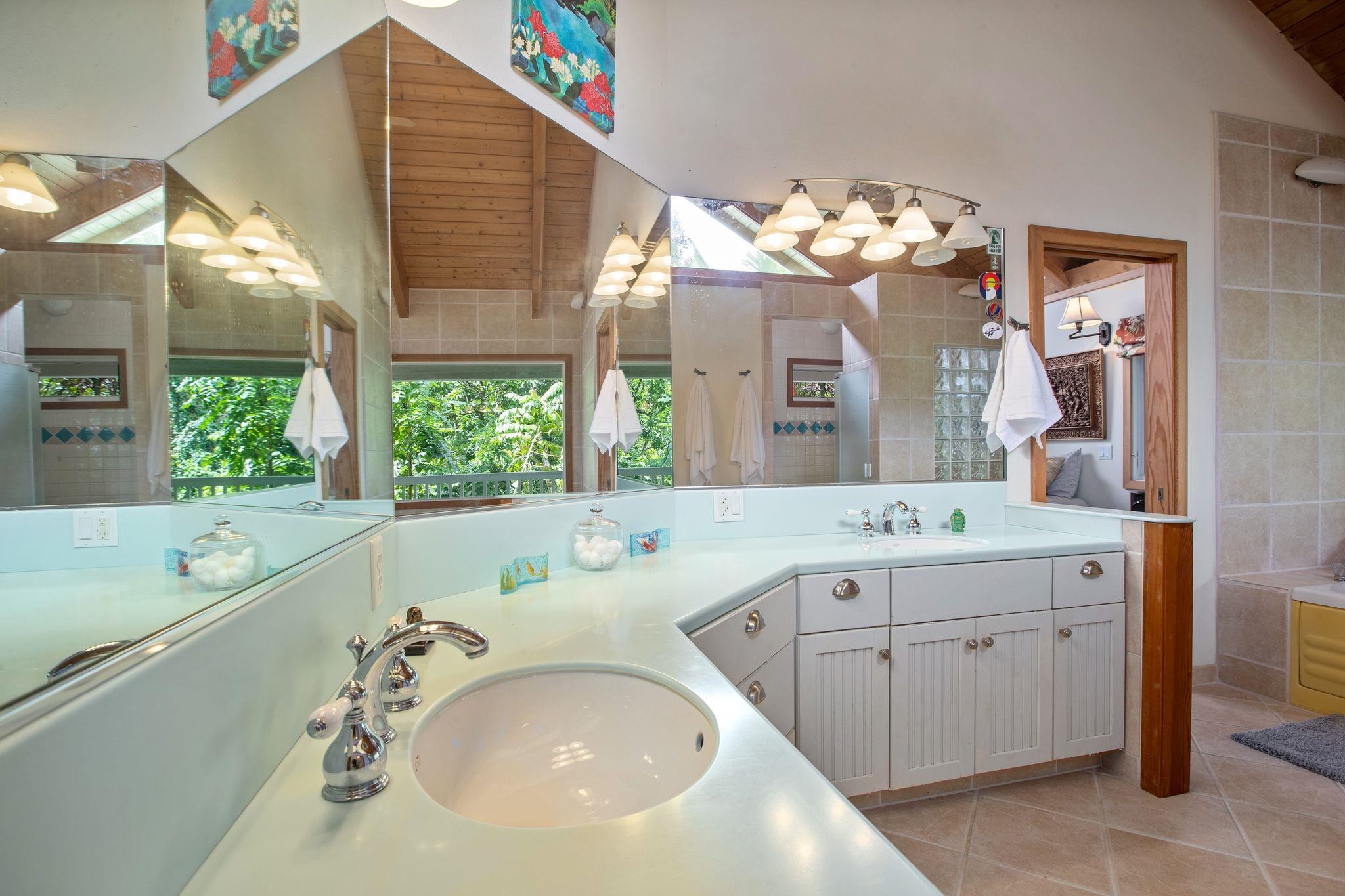 285 Kalo Road Hana, HI 96713 - Photo 17 of 36 a bathroom with a tub sink and mirror