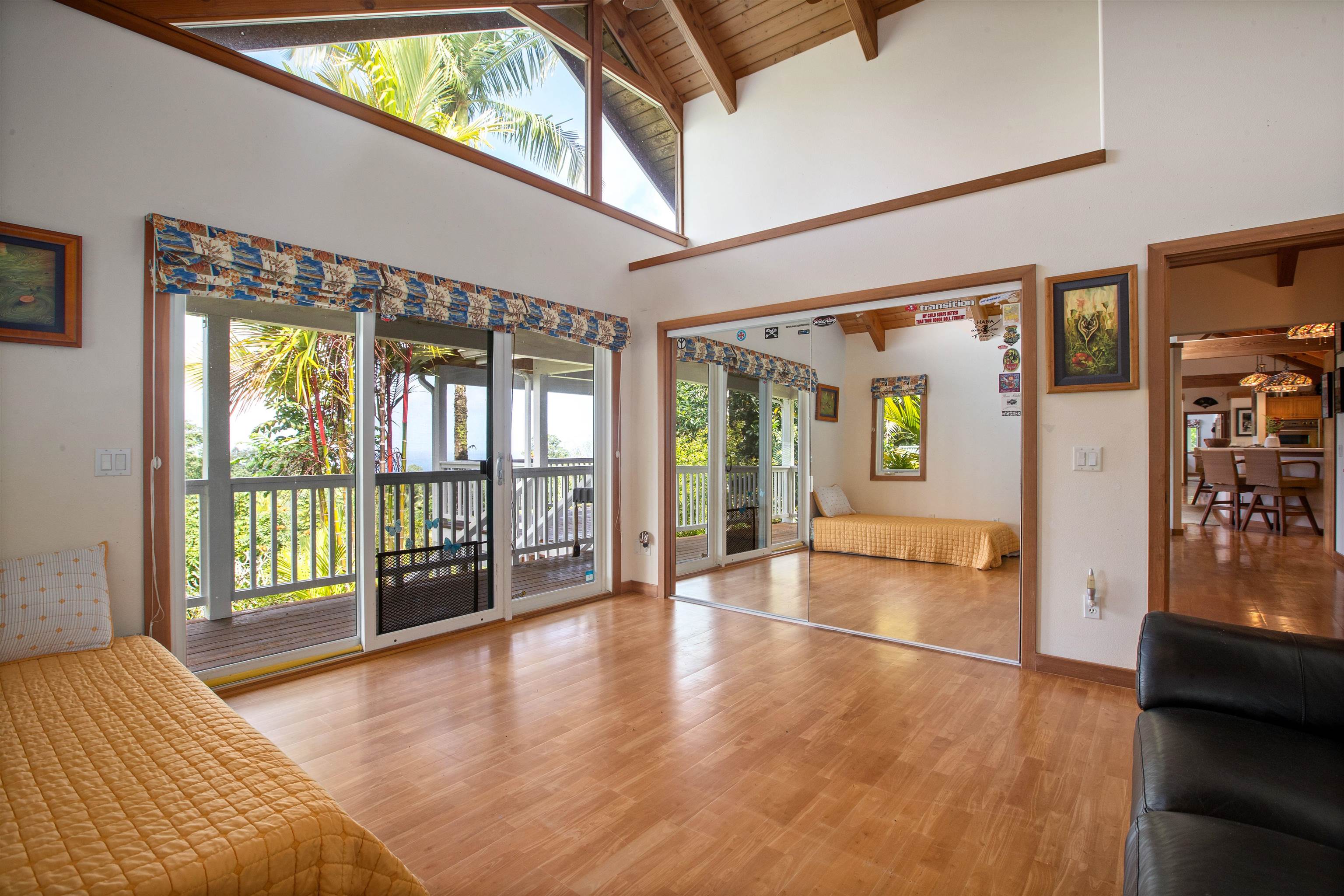 285 Kalo Road Hana, HI 96713 - Photo 20 of 36 a view of an entryway with wooden floor and windows