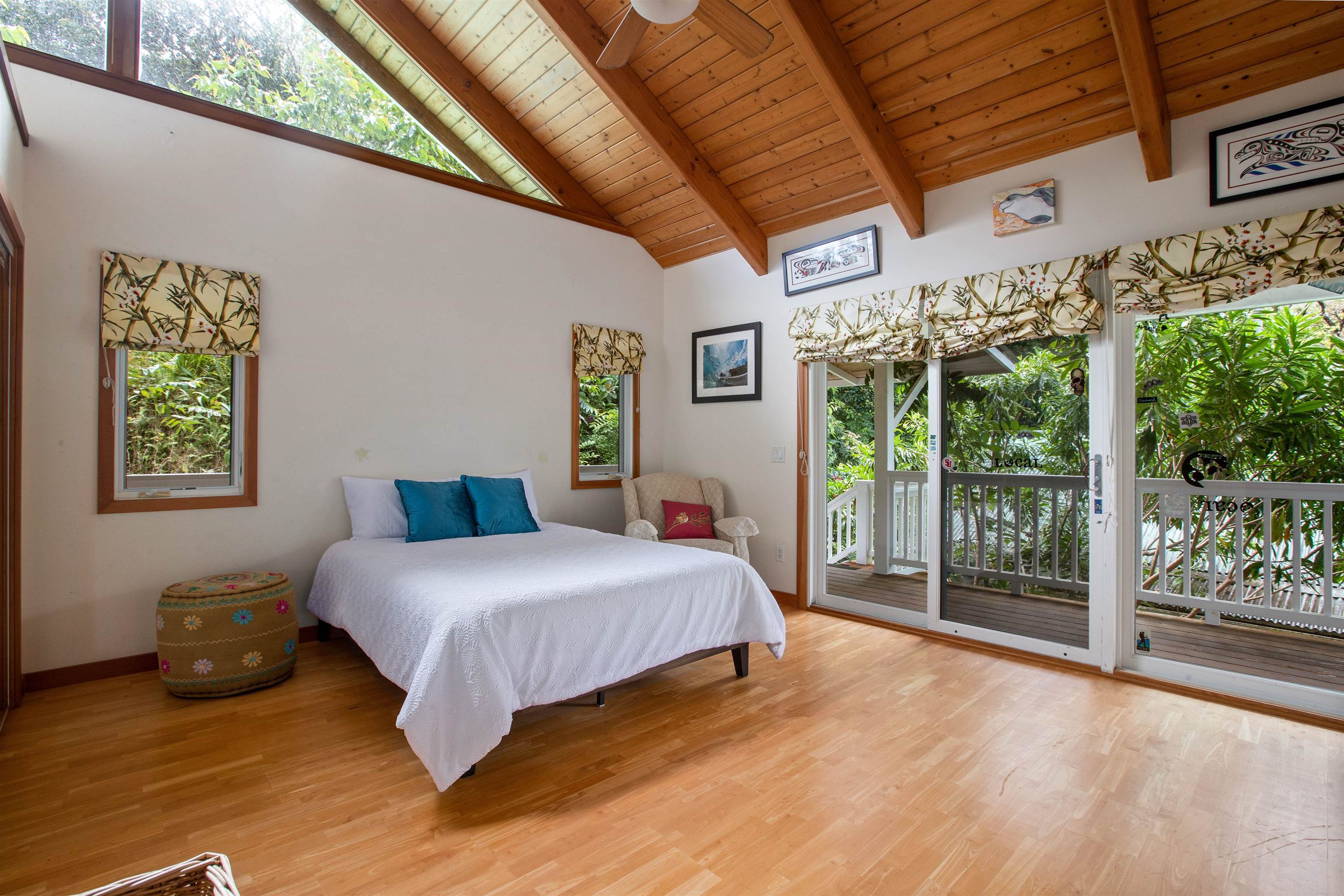 285 Kalo Road Hana, HI 96713 - Photo 22 of 36 a bedroom with a bed and a large window