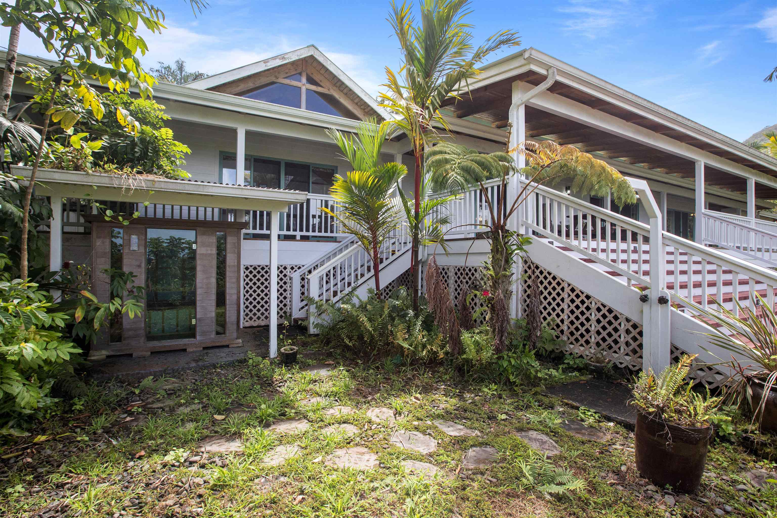 285 Kalo Road Hana, HI 96713 - Photo 32 of 36 a front view of a house with a yard